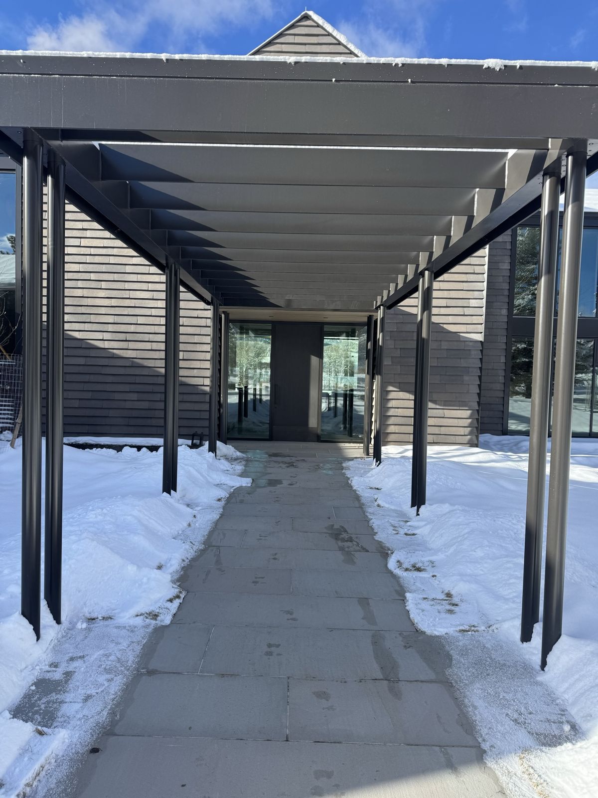 Entry walkway of large-format stone pavers