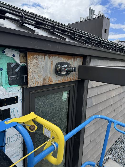 Steel structural mount and bracket on the building exterior.