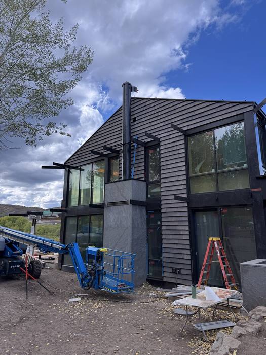 Corner of the building with finished steel window surrounds.