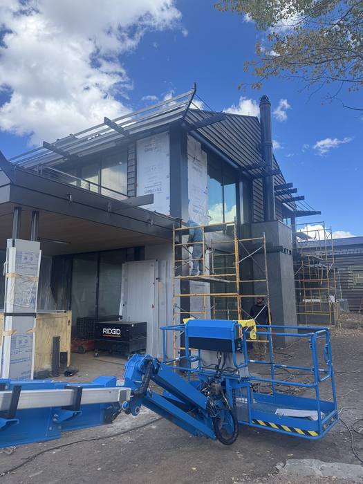 Corner under construction with exposed steel headers.