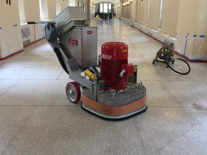 Terrco grinder running the length of the corridor under the vaulted ceiling.