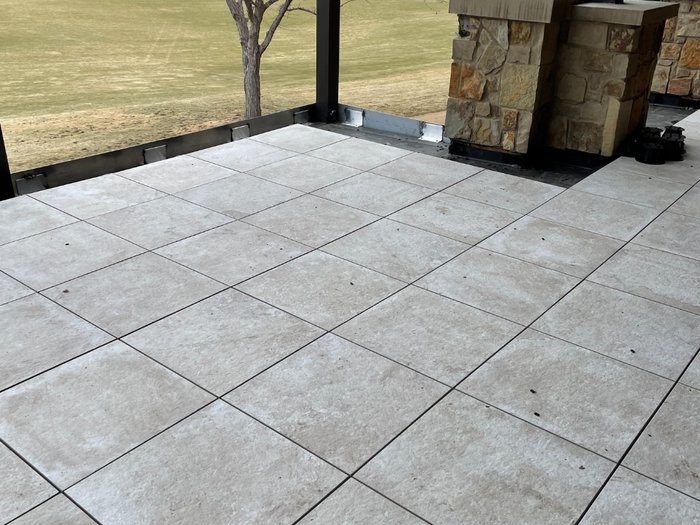 Finished deck — tight, even joints across the full field with the golf course beyond.